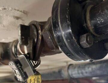 Padlock in lock wing valve on gas riser