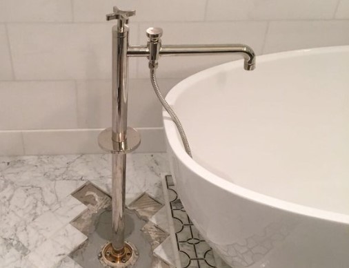 Free standing tub filler
