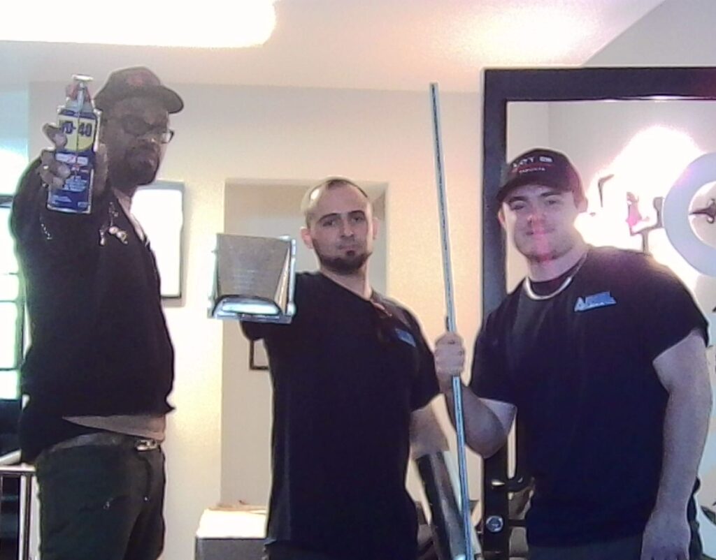 3 team members posing together in office