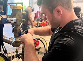 Ariel Services employee completing backflow prevention tester training